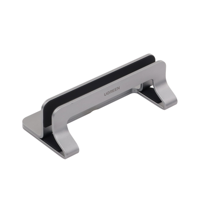 Soporte Vertical para Laptop / Adecuado para escritorio / Anchura Ajustable (12-26mm) / Amplia compatibilidad / Anti-Arañazos / Anti-Deslizante /Ajustable Mediante Tornillos / Color Plata / Aluminio + Silicona